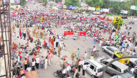 Protesters squat at the Bharat Nagar Chowk on the Ferozepur Road during a nationwide strike in Ludhiana on Tuesday.