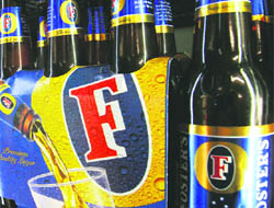 A six pack of Fosters beer is displayed at a store in Melbourne on Wednesday.