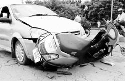 The mangled remains of the Tata Indica and the Honda Activa at the road separating Sectors 4 and 11 in Panchkula on Wednesday