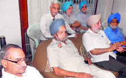 Members of the Save Sukhna Forum deliberate upon an action plan at Sukhna Lake in Chandigarh on Wednesday