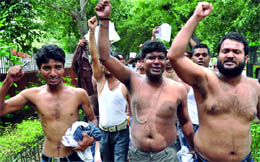 Candidates who could not clear the civil services preliminary exam 2010 shout slogans against the UPSC, demanding the cut-off disclosure outside the UPSC building in New Delhi on Wednesday