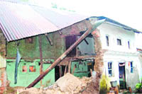 A house that was damaged due to incessant rain in Dehradun over the past few days