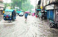 A road turns into a stream following incessant rain in Dehradun