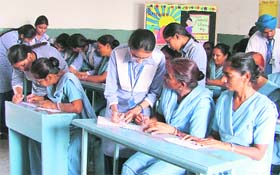 Students of GMT Public School teach Class IV employees on the World Literacy Day in Ludhiana