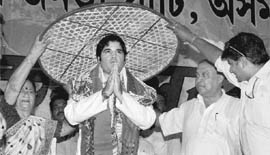 BJP leader Varun Gandhi being honoured with a traditional cap (japi) at a party meeting in Guwahati on Wednesday.