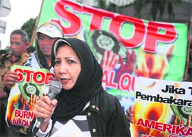 A group of Indonesian Muslims and Christians rally at a Jakarta traffic roundabout on Wednesday to denounce the plans to burn the Koran by a US evangelical church