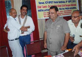 Past president of Rotary Club, Bathinda Cantt. Parshotam Bansal greets newly- elected president Rai Sahib Verma at the 11th installation ceremony in Bathinda on Wednesday night