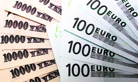 100 Euro notes are spread out next to Japanese 10,000 yen notes at Interbank Inc. money exchange in Tokyo on Thursday. The euro eased below $1.2700 as investors focused on comments late on Wednesday from European Central Bank Executive Board member Juergen Stark, who told a meeting of German lawmakers that German banks were undercapitalised, according to a participant