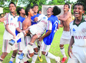 Elated members of Mohun Bagan team from Kolkata after winning the 8th Administrator's Soccer Cup at the Sector 17 football stadium in Chandigarh on Thursday. 