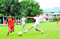 Players vie for the ball during a match at the Sub-Junior Inter School Football Tournament in Dehradun