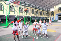 A basketball match in progress at the Gardner Silver Jubilee Inter-School Basketball Tournament for Girls in Dehradun