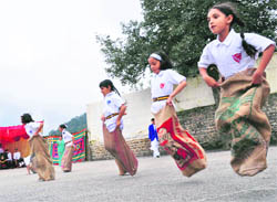 Students of Auckland House School participate in a sack race in Shimla 