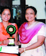 Rajni of Government Arts & Sports College, Jalandhar, who came first in a group discussion competition at Hindu Kanya College, Kapurthala, being honoured.