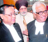 Justice Ranjan Gogoi with Chief Justice of Punjab and Haryana High Court Justice Mukul Mudgal after the oath-taking ceremony in Chandigarh on Thursday.