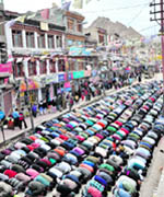 Devotees offer prayers on the eve of Eid in Leh