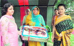 Convener, Family Welfare Organisation of Crossed Swords Division, Payal Sharma, felicitating Veer Naris during a function in Khour near Akhnoor 