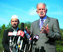 Pastor Terry Jones of the Dove World Outreach Center speaks to the media as Imam Muhammad Musri of the Islamic Society of Central Florida looks on, in Gainesville on Thursday.  AP/PTI