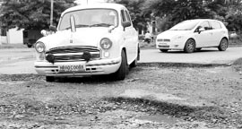 Damaged link roads at Industrial Area, Phase II,
