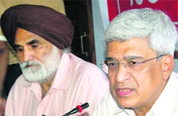CPM general secretary Prakash Karat (right), along with Punjab CPM general secretary Charan Singh Virdi, at a press conference in Chandigarh on Saturday.