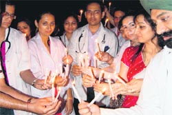 Doctors of Government Multi-Speciality Hospital, Sector 16, take out a candle march in Chandigarh on Saturday.
