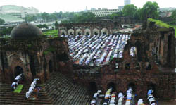 Devotees offer Eid prayers at the Ferozeshah Kotla Fort amidst rain in New Delhi 