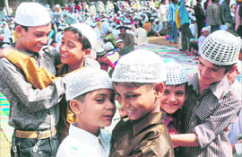 Children exchange greetings after offering namaz on the occasion of Eid-ul-Fitr in Karnal on Saturday.