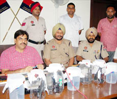 Police officials brief the press about the findings in Nawanshahr on Saturday.