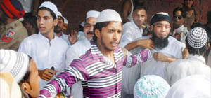 A maulvi being manhandled at the Devi Talab mosque in Jalandhar on Saturday. 