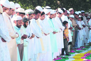Devotees offer namaz on the occasion of Eid at Eidgah in Jammu on Saturday.