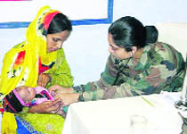 An Army doctor examines a child at a medical camp at Mahore in Reasi district on Saturday. 