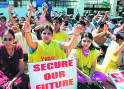Kashmiri Pandit youth hold a protest in Jammu on Saturday.