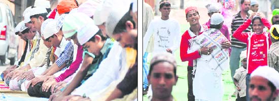 Devotees offer prayers while youngsters embrace each other (right) on Eid-ul-Fitr in Ludhiana