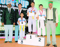 Winners of the National Juapa Karate Championship with their medals in Mussoorie on Sunday