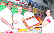 Razia Beg, president, Bar Council of Uttarakhand, Nainital, receives an award from Congress leader ND Tiwari in Dehradun on Sunday. 