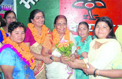 Brijlesh Gupta, mahanagar president of the BJP Mahila Morcha, being felicitated in Dehradun on Sunday.