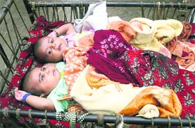Two newborn babies, who had a miraculous escape after lightning struck their cradle at Darba in Sirsa