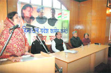 Returning Officer Rajani Patil addresses a party meeting in Shimla on Monday. 