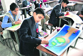 Children take part in a painting competition held at Sanjauli College in Shimla on Sunday. 
