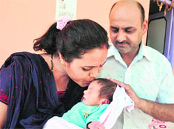 Santosh and Khem Raj along with the abandoned baby in Rajouri