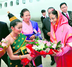President Pratibha Patil receives a bouquet as she arrives at Luang Prabang, Laos