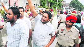 Members of the Unemployed ETT Teachers Union being arrested near the house of Cabinet Minister Ranjit Singh Brahmpura, in Amritsar on Sunday.