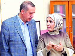 Turkeys Prime Minister Tayyip Erdogan and his wife Emine at a polling station