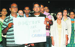 Doctors stage a protest outside the entrance gate of the GMSH, Sector 16, in Chandigarh