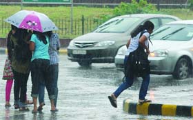 Girls caught in the downpour in New Delhi