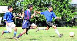A match in the Junior Council Football Tournament in progress in Dehradun on Monday. 