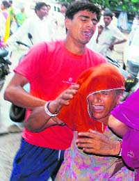 Inconsolable relatives of accident victims outside the Civil Hospital, Bhiwani