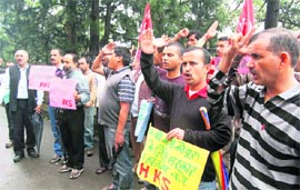 Activists of the Himachal Kisan Sabha protest outside the DC office in Shimla on Monday.