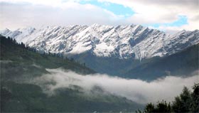 Pir Panjal ranges wear a white blanket in Manali region on Monday.