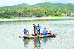 Naval divers from New Delhi search for the missing medico, Syed Zuhaib Rizvi, in the Mansar Lake on Monday.