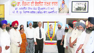 Vice-Chancellor Dr MS Kang along with Kisan Club president Pavittar Pal Singh Pangli at the newly named Borlaug Wheat Auditorium at the PAU in Ludhiana on Monday.